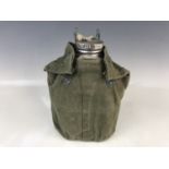 A post-war British Army 1944 Pattern water bottle and webbing cover