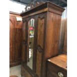 A Victorian mahogany and walnut double wardrobe (a/f)