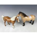 A Beswick highland horse together with one other