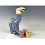 A kitsch ceramic novelty liqueur decanter and glass set modelled as a Bactrian camel, circa 1930s-