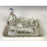 A four-piece opalescent glass dressing table set decorated with hand enamelled blossom