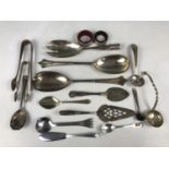 A Victorian silver salad server (handle lacking), 68.8g, a silver napkin ring, and two silver