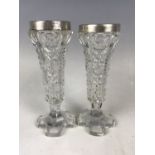 A pair of silver collared cut glass bud vases