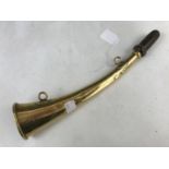 An antique brass horn retailed by J Tournier of Paris, 27 cm