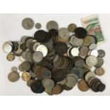 A quantity of GB and world coins together with a Reserve Bank of Zimbabwe banknote