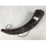 A leather bound hunting horn