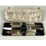 A cased Thomas W. Cock & Son antler-handled three piece carving set