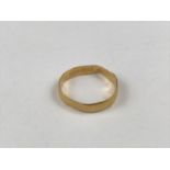 A 22ct gold wedding band, 3g