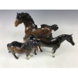 A Beswick shire horse together with two others