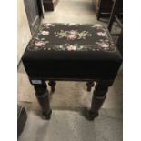 A Victorian embroidered footstool