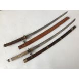 A reproduction Japanese shin gunto sword and one other sword