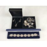 Silver and white-metal jewellery including three-penny piece coin bracelet, a cased marcasite and