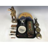 Sundry collectors' items including Victorian horse brasses, a Black Forest carved figure and pipes