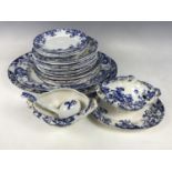 A quantity of late 19th century flow blue dinner ware including a soup tureen with ladle, ashets and