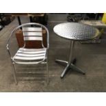 Three contemporary aluminium bistro circular tables together with a set of eight stacking chairs