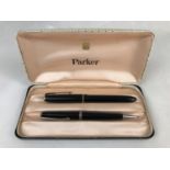 A vintage Parker fountain pen with case together with a propelling pencil