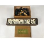 A chess set together with Victorian bone and ebony double-nine dominoes
