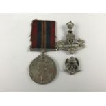 A War Medal, Green Howards cap badge and Auxiliary Air Force lapel badge