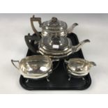 A Walker and Hall electroplate Georgian-shape three-piece tea service together with one other