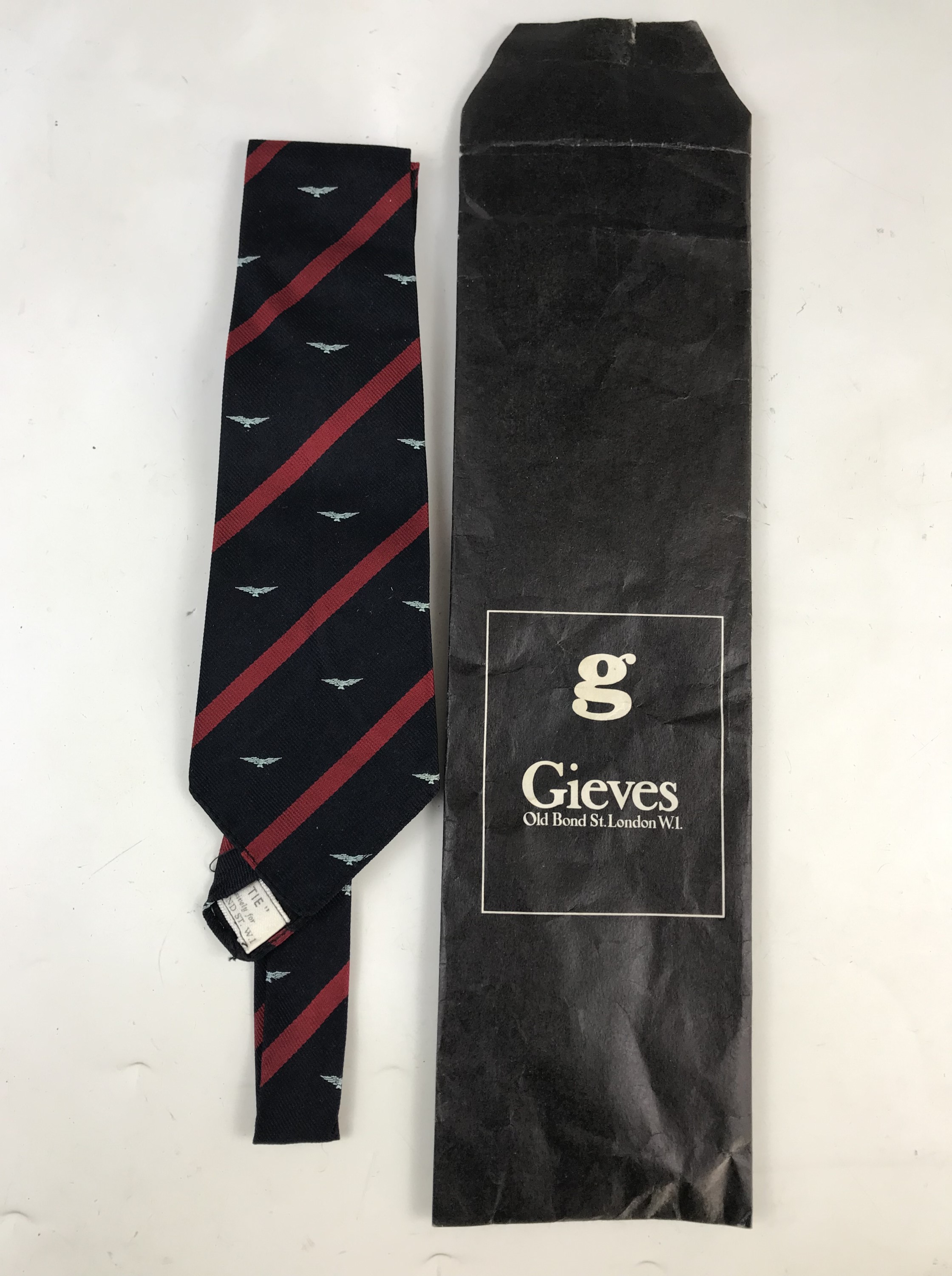 A gentleman's Gieves of London 'O.P.T.C' silk tie, decorated with the RAF device