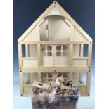 A contemporary dolls house and furniture