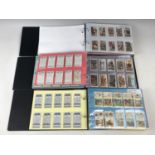 Three tea / cigarette card albums and contents including the themes people, places and