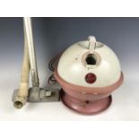 A 1950s Hoover "Constellation" vacuum cleaner in pink