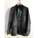 An inter-War black leather driving jacket bearing a machine-embroidered label which reads The