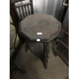 A carved mahogany hexagonal occasional table, height 61 cm