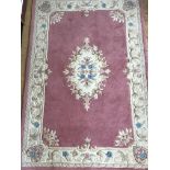 An Akbar rose and ivory rug, 120 x 180 cm