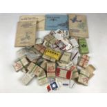 A quantity of vintage cigarette cards and several albums of such pertaining to the RAF and aviation
