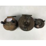 Three vintage wooden centre-pin fishing reels