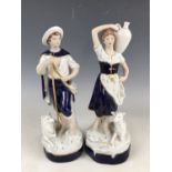 A pair of Royal Dux figurines, 23 cm