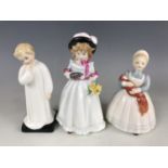 Three Royal Doulton figurines including Sharon HN3047, The Rag Doll HN2142 and Darling HN1985