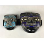 Two Aztec masks inlaid with abalone shell