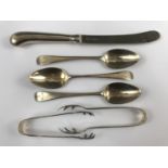 Georgian silver teaspoons together with two silver sugar tongs and a knife