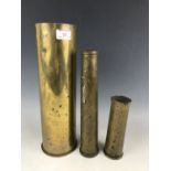 Three brass shell cases
