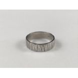 An 18ct white gold bark effect wedding band, 5.8g