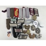 A quantity of largely post-War German military insignia, medals etc