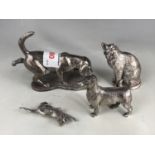 Two cast metal dog figures together with two cat figures