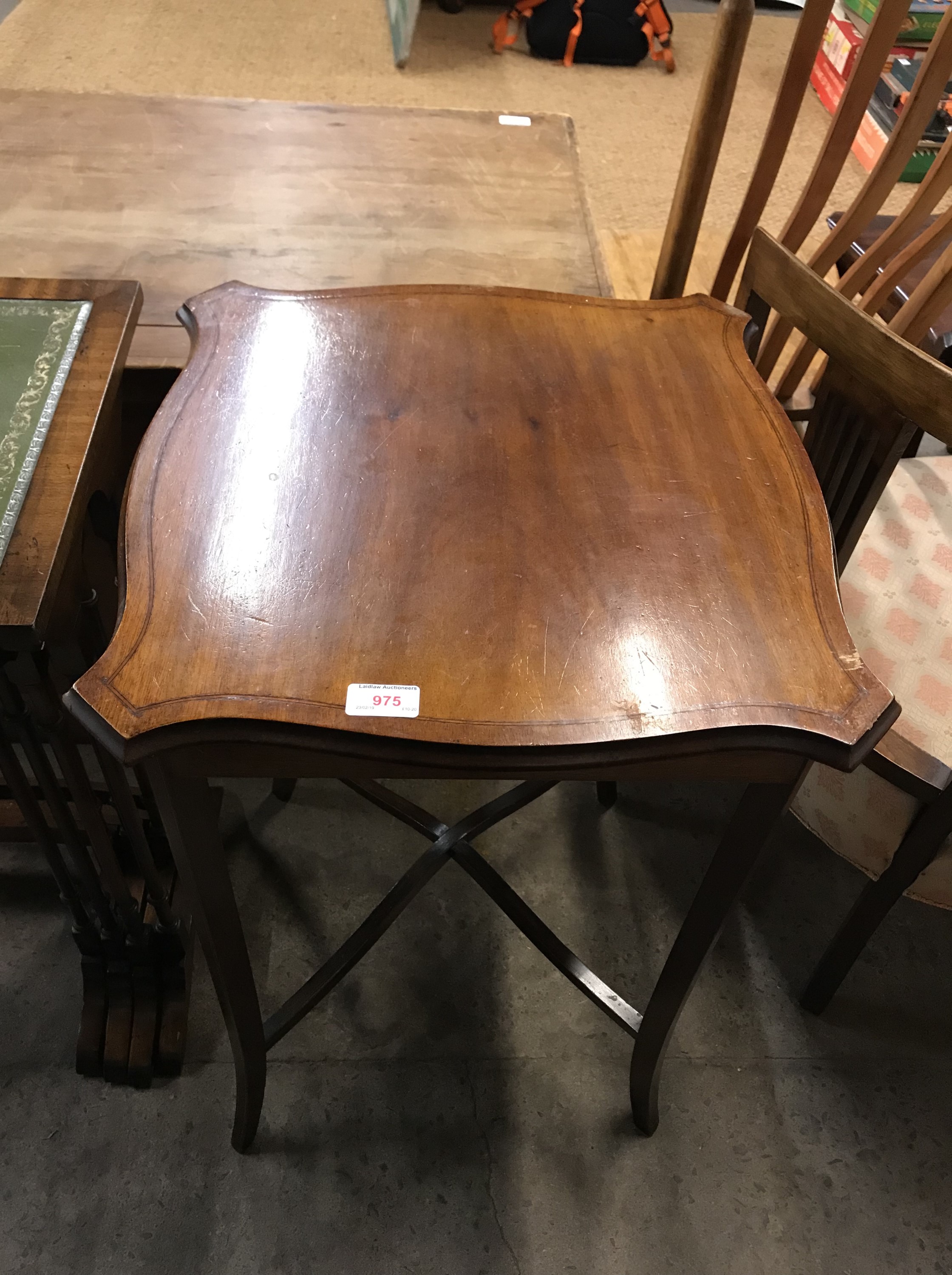 An Edwardian Sheritan revival string inlaid mahogany occasional table