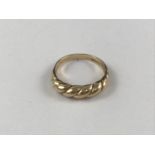A 9ct gold dress ring, the face of cabled form, 3.4g