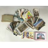 A quantity of postcards including humorous and scenic views etc