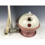 A 1950s Hoover Constellation vacuum cleaner in pink