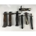 A quantity of military knife and bayonet hilts