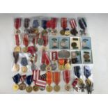 A quantity of largely Polish military and other insignia, medals etc
