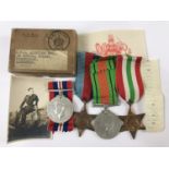 Second World War campaign medals, an RAF issue medal carton and contents, and a photograph of an RAF