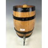 An oak coopered spirit barrel with tap