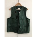 A Bob Church & Co sporting vest of dark green cotton, size L, in 'as new' condition
