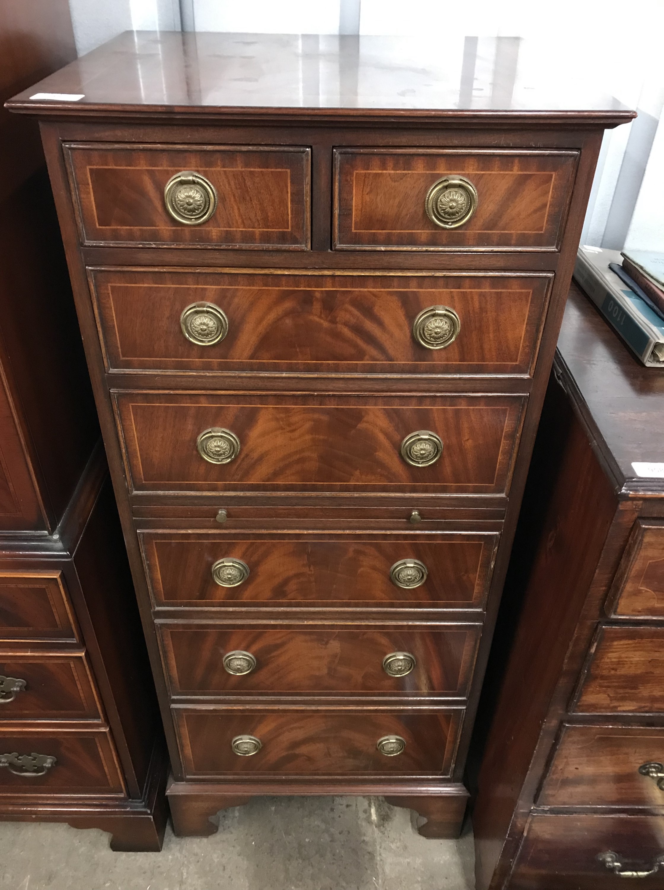 A quality Georgian style slender mahogany chest with writing slide of diminutive stature, 49 x 41